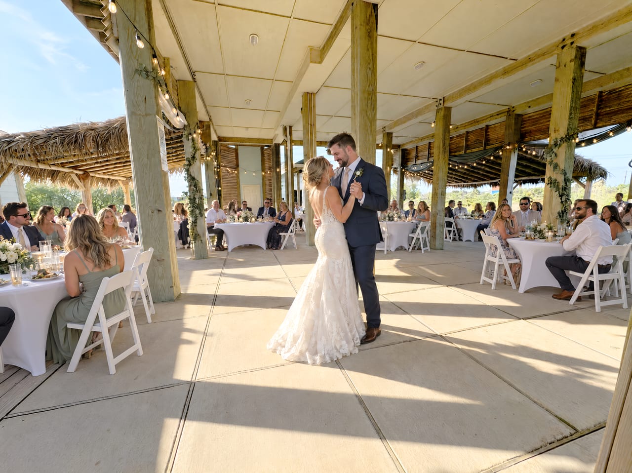 Covered ceremony and reception area and a dance floor at Beauty and the Beach in Crystal Beach, Texas
